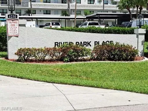 Community sign featuring a lawn