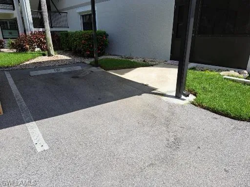 Dedicated Parking slot next to the lanai door for easy entry/exit and unloading your vehicle. .
