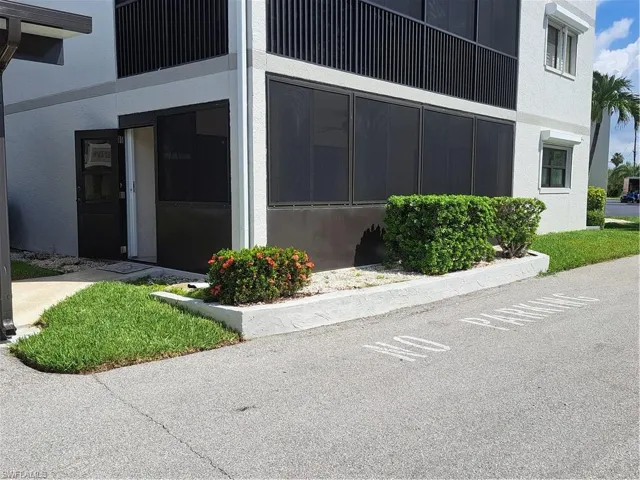 Screened Lanai adjacent to dedicated parking spot