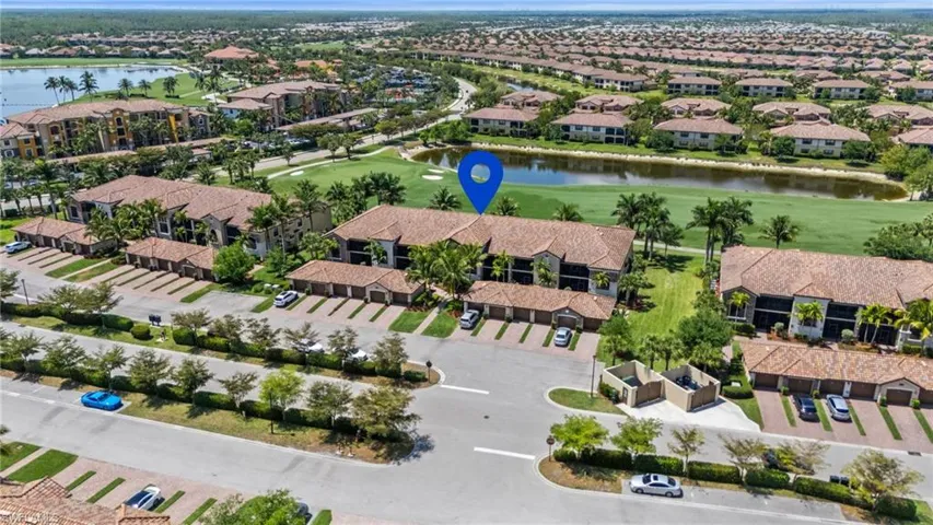 Bird's eye view featuring a water view, view of golf course, and a residential view