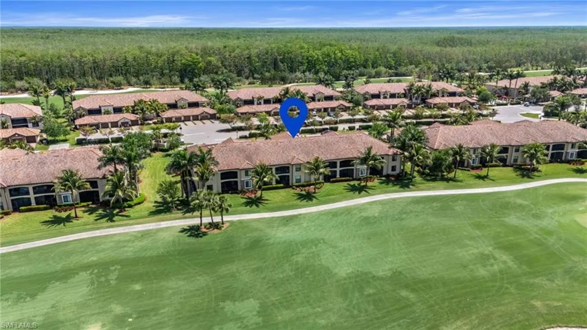 Drone / aerial view with view of golf course, a residential view, and a wooded view