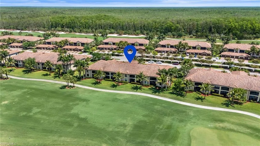 Birds eye view of property with view of golf course, a residential view, and a forest view