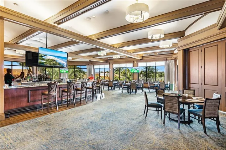 Dining space featuring beam ceiling and carpet flooring