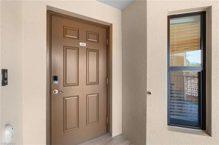 View of exterior entry with stucco siding