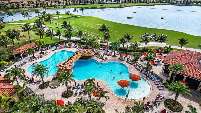 Drone / aerial view with a water view and golf course view
