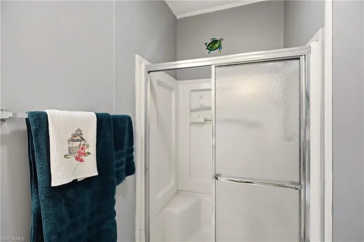 Full bathroom with a shower stall
