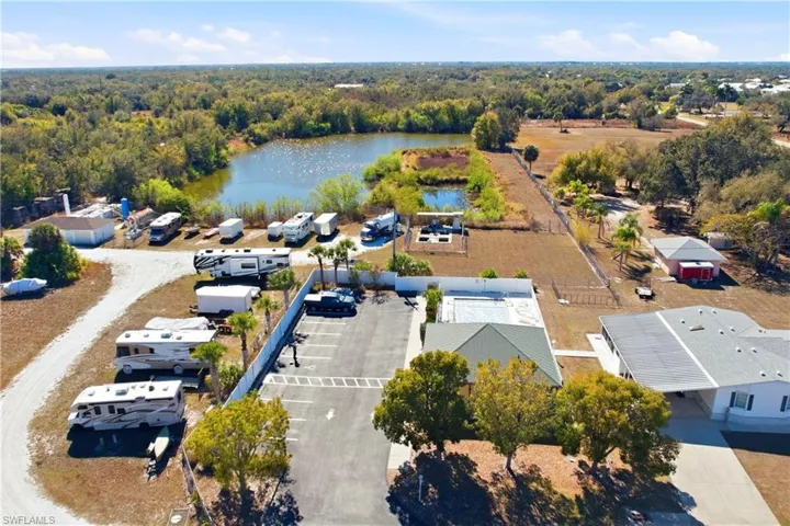 Aerial overview of property's location with a large body of water