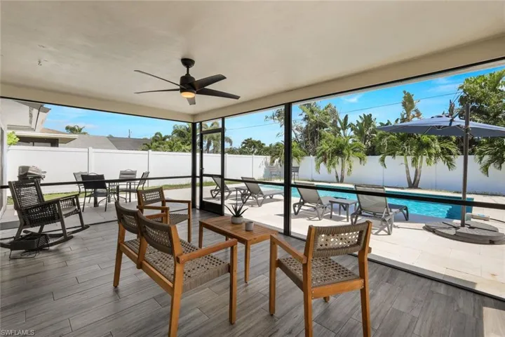 Sunroom featuring plenty of natural light and ceiling fan