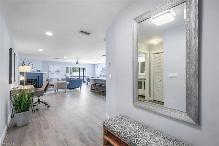Home office featuring ceiling fan and hardwood / wood-style flooring