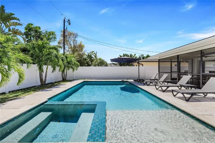 View of pool featuring an in ground hot tub and a patio area