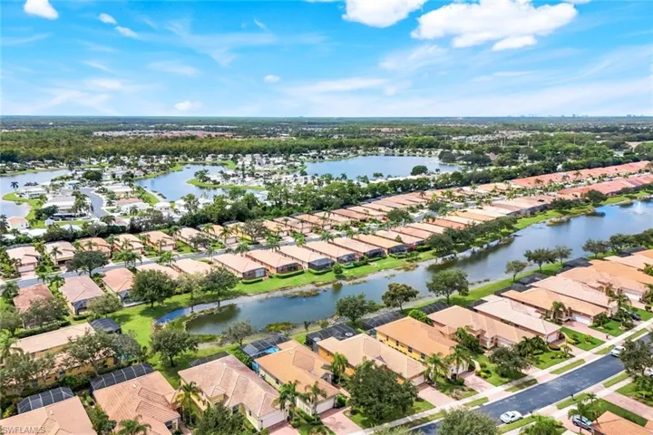 Aerial overview of property's location with nearby suburban area and a large body of water