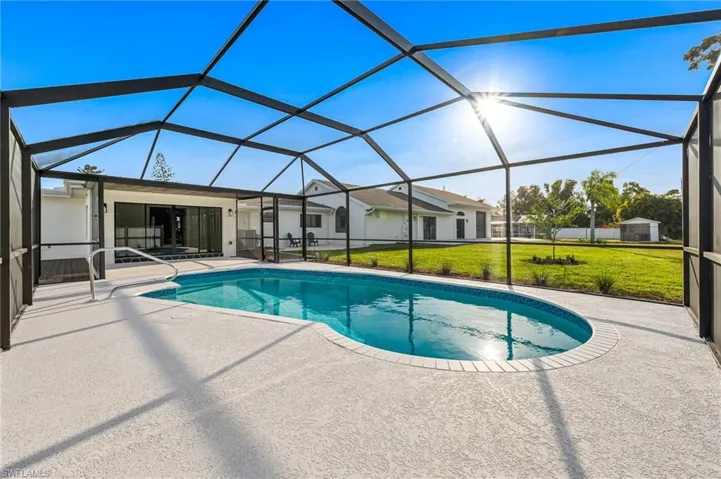 Large Pool and pool deck with and huge backyard