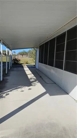 View of patio featuring a carport