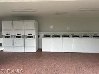 Laundry room with stacked washer and dryer