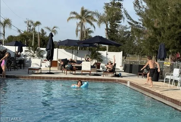 View of pool with a patio area