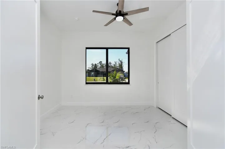 Spare room featuring ceiling fan