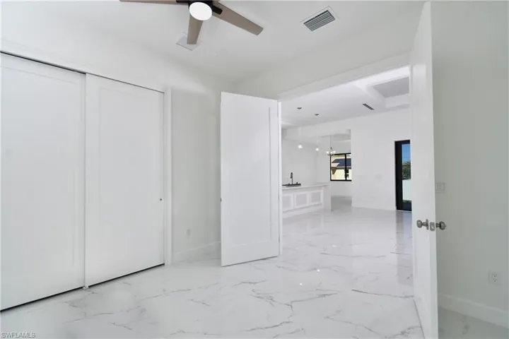 Unfurnished bedroom featuring ceiling fan