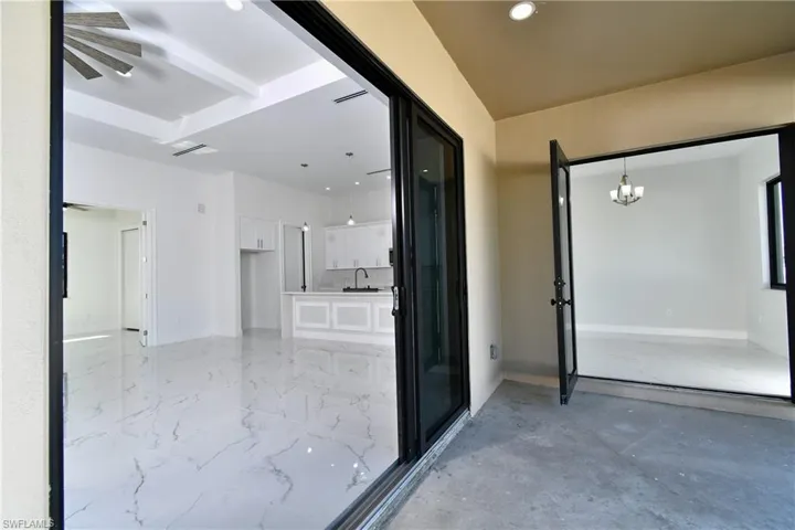 Corridor with a chandelier and sink