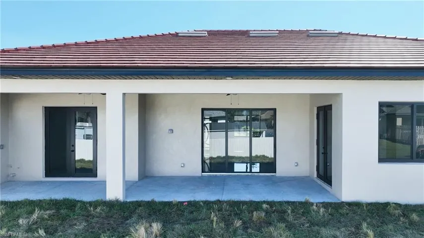 Rear view of property with a patio