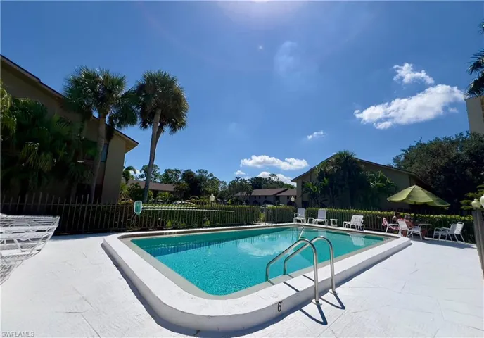 Community pool featuring a patio