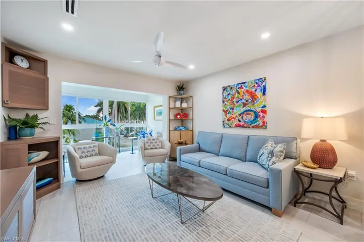 Living area featuring ceiling fan and recessed lighting