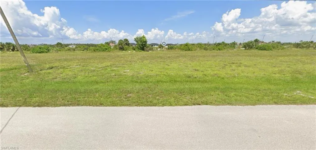 View of yard with a rural view