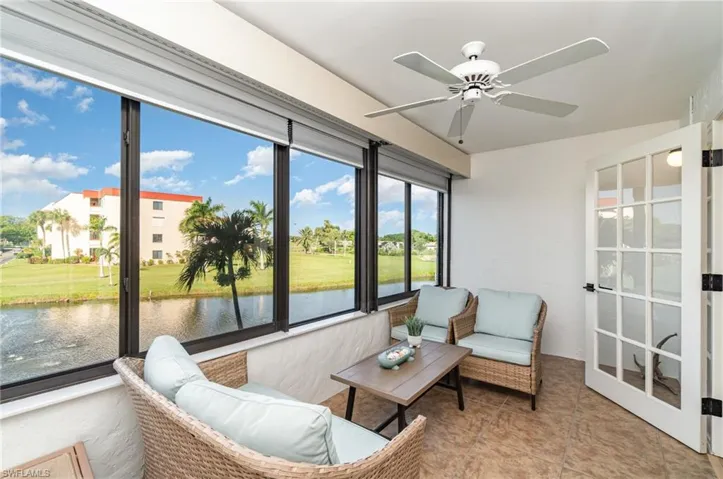 Lanai with western lake view, sliding hurricane resistant windows and french doors