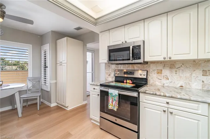 Kitchen looking towards front door and breakfast area