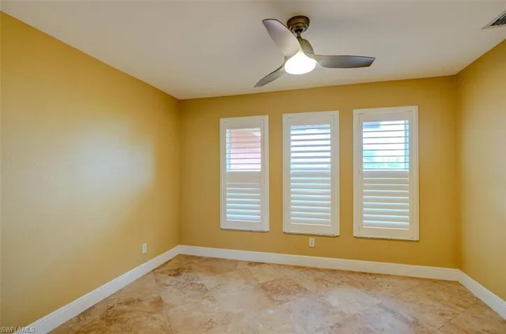 Spare room featuring ceiling fan