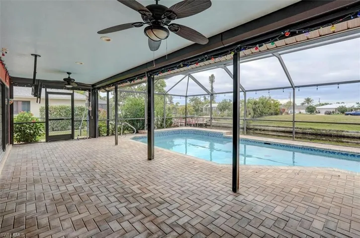 View of pool featuring ceiling fan