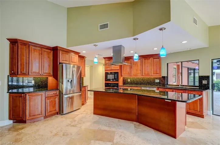 Kitchen featuring a center island, high vaulted ceiling, decorative light fixtures, island range hood, and black appliances