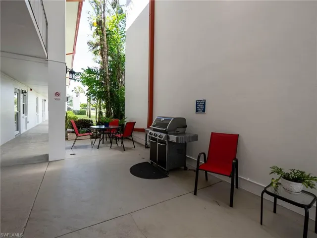 View of patio featuring area for grilling