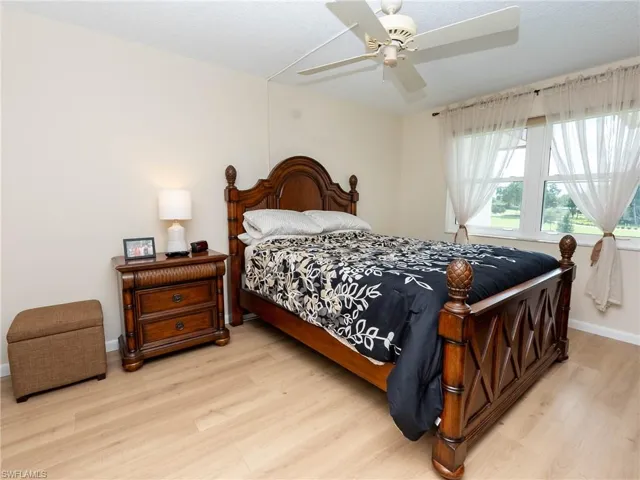 Bedroom featuring ceiling fan and light hardwood / wood-style flooring