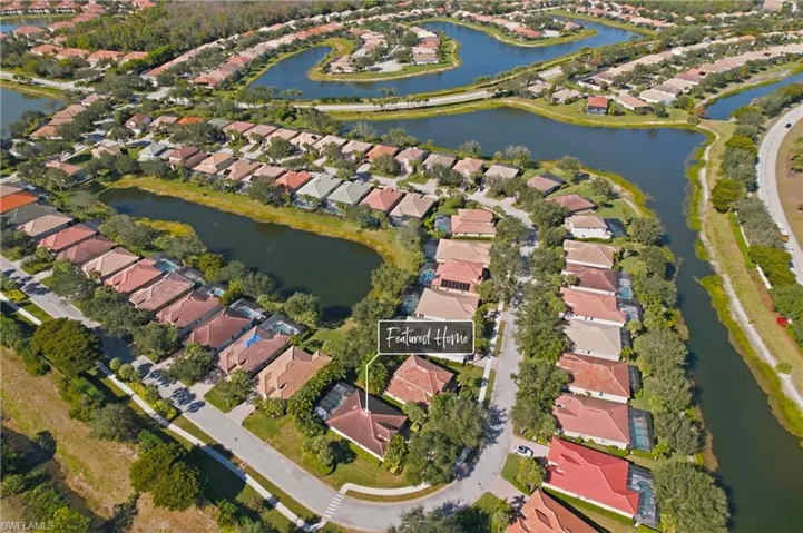 Aerial view of property's location featuring nearby suburban area and a nearby body of water