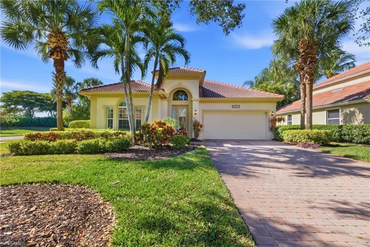 Mediterranean / spanish-style house featuring stucco siding, decorative driveway, a garage, and a tiled roof