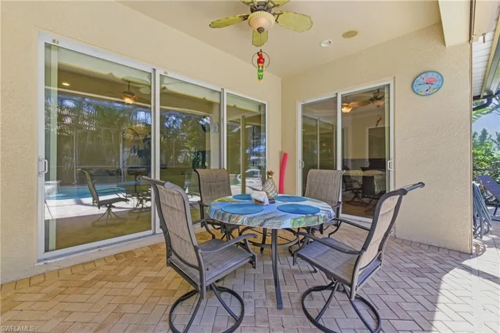 View of patio / terrace with outdoor dining space and ceiling fan