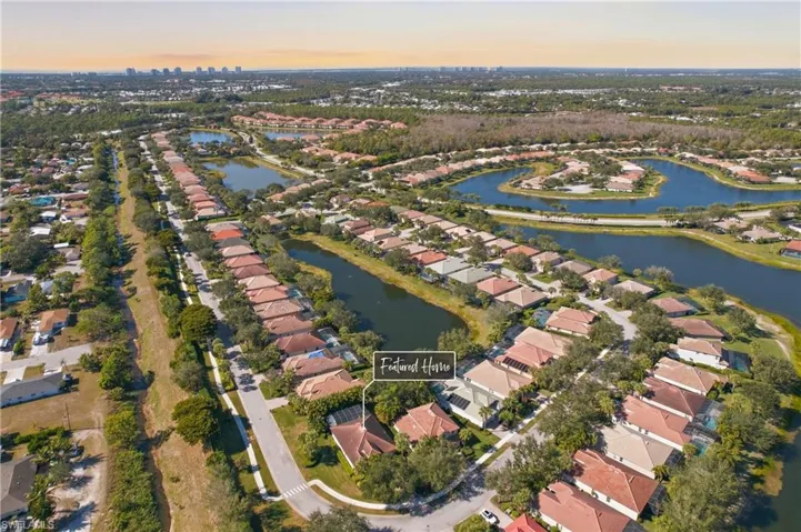 View of property location featuring nearby suburban area and a nearby body of water
