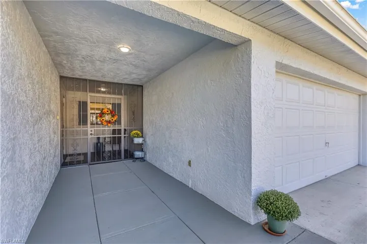 Property entrance with a garage