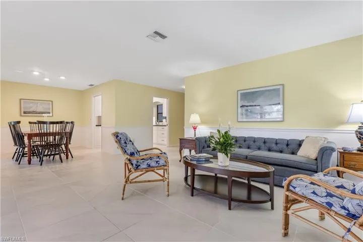 Living room with light tile patterned flooring