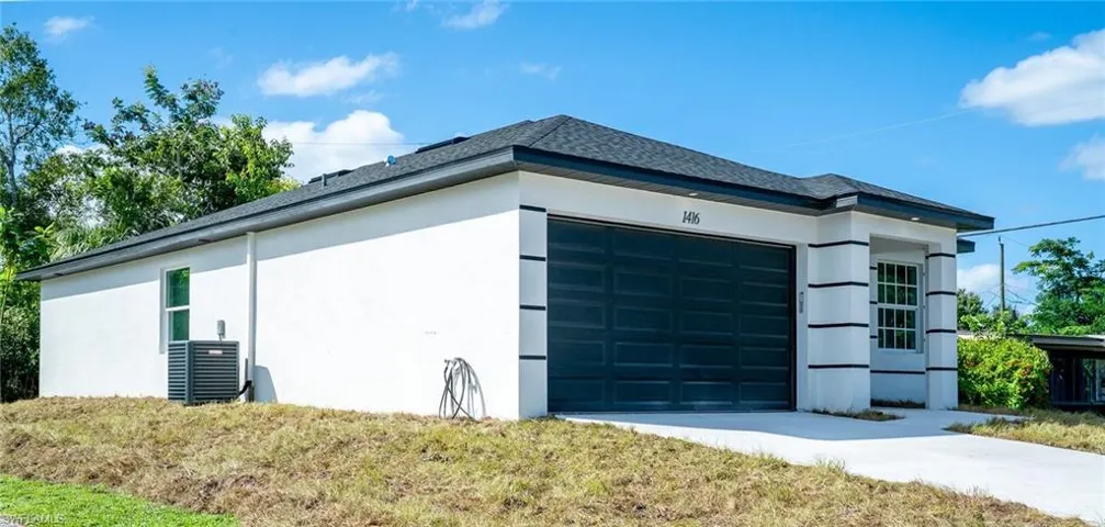 Garage with concrete driveway