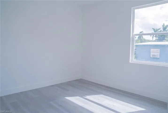 Spare room with light wood finished floors and baseboards
