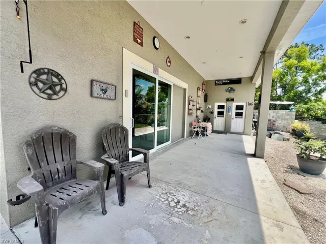 Covered porch off of the detached garage with access to private bathroom.