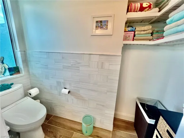 Primary bathroom with private water closet and extra storage.
