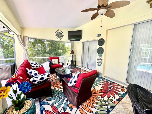 Covered patio overlooking the pool with pocket sliding doors from the interior of the home.
