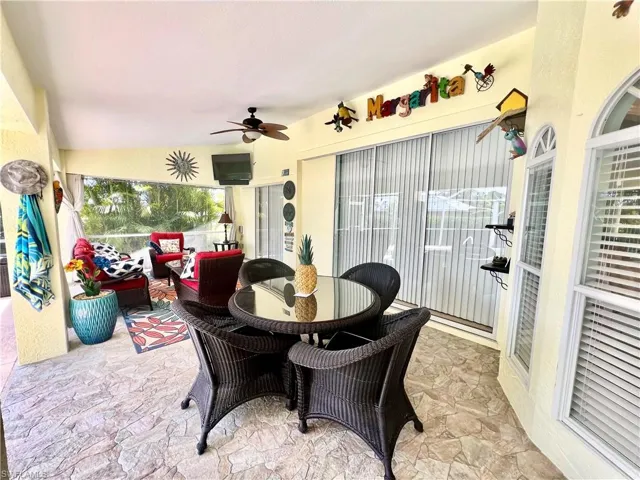 Covered patio overlooking the pool with pocket sliding doors from the interior of the home.