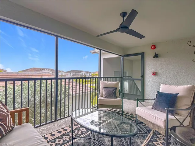 Sunroom featuring a residential view