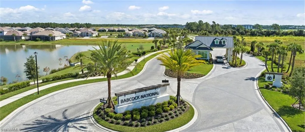 View of community with a water view, curved driveway, and a residential view