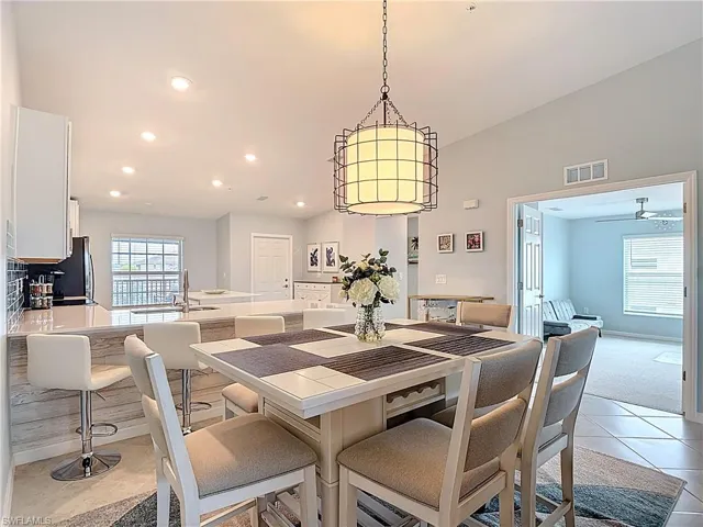 Dining room with recessed lighting, light tile patterned floors, and a ceiling fan