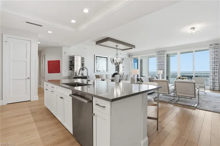 A grand kitchen island elegantly merges functionality and sophistication.