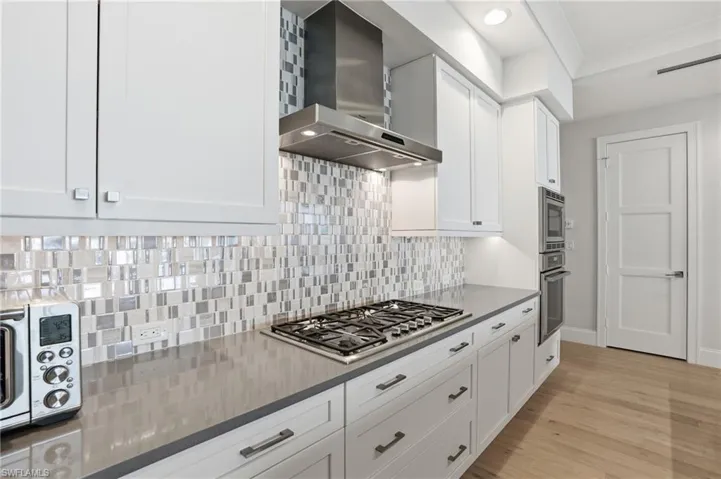 Notice the beautiful custom backsplash.